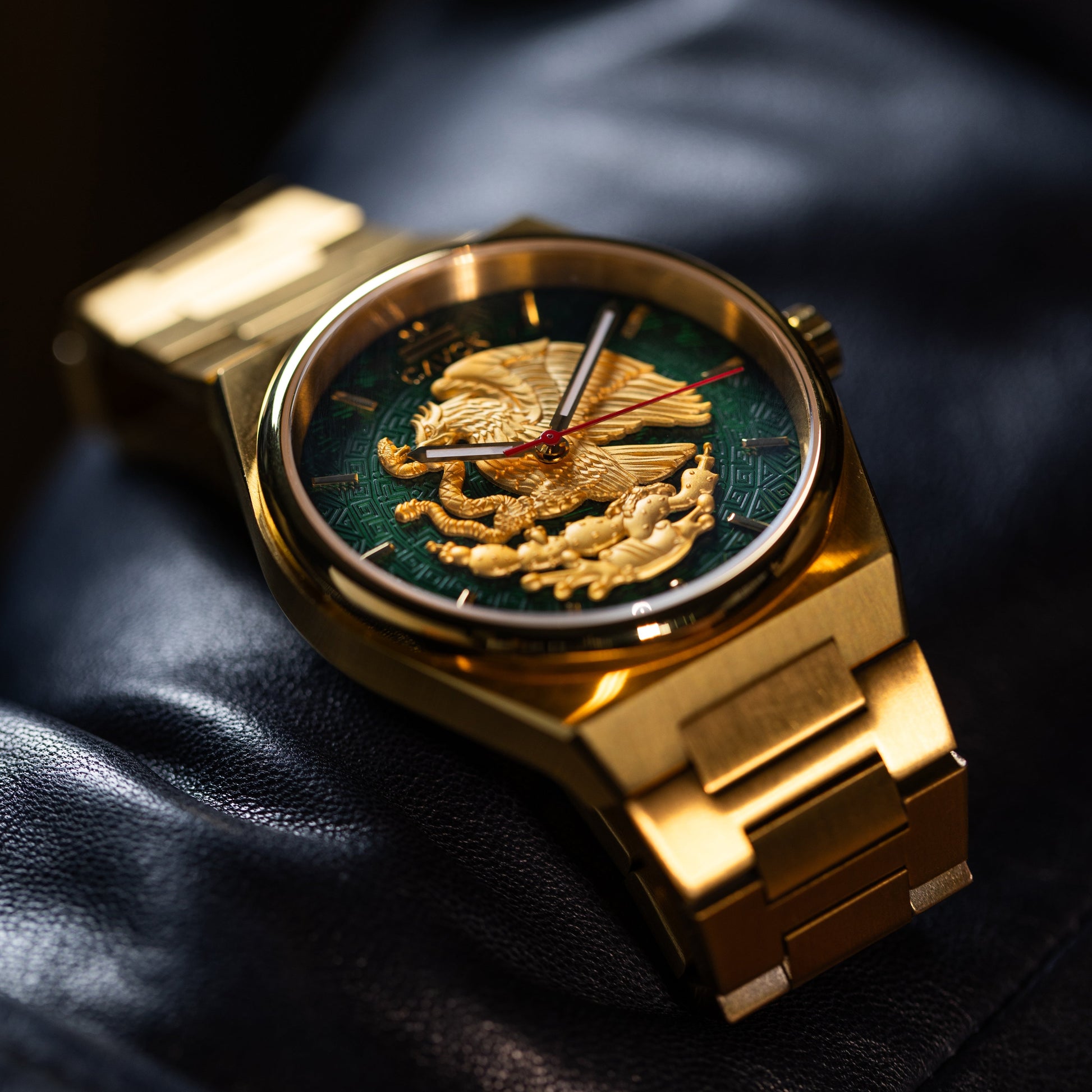 Aguila Mexicana watch with a detailed face on a dark surface