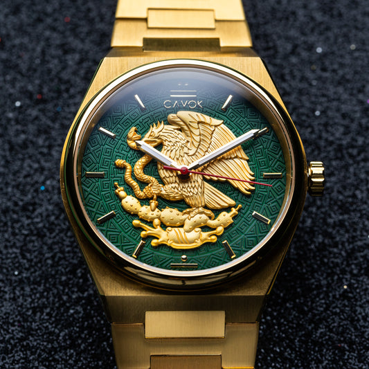 Mexican Eagle watch with a green face featuring an eagle emblem on a dark textured background