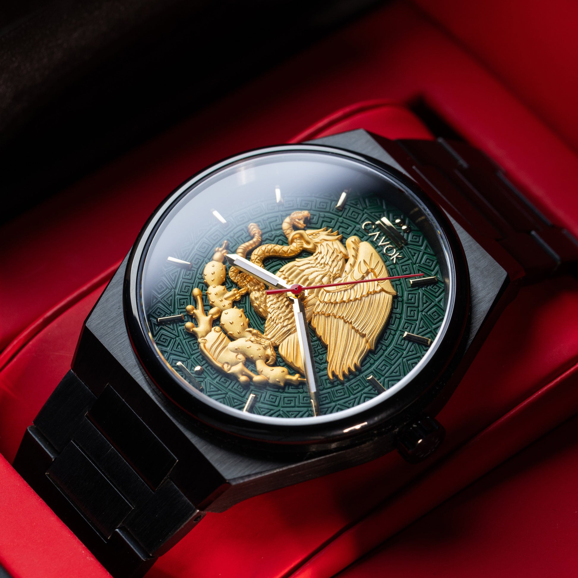 Luxury Mexican Eagle watch with intricate design on a red background