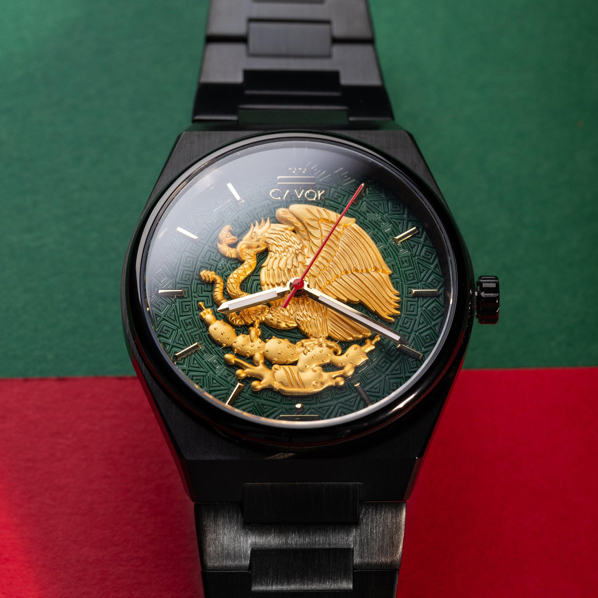 Mexican Eagle Watch with gold eagle design on a green and red background
