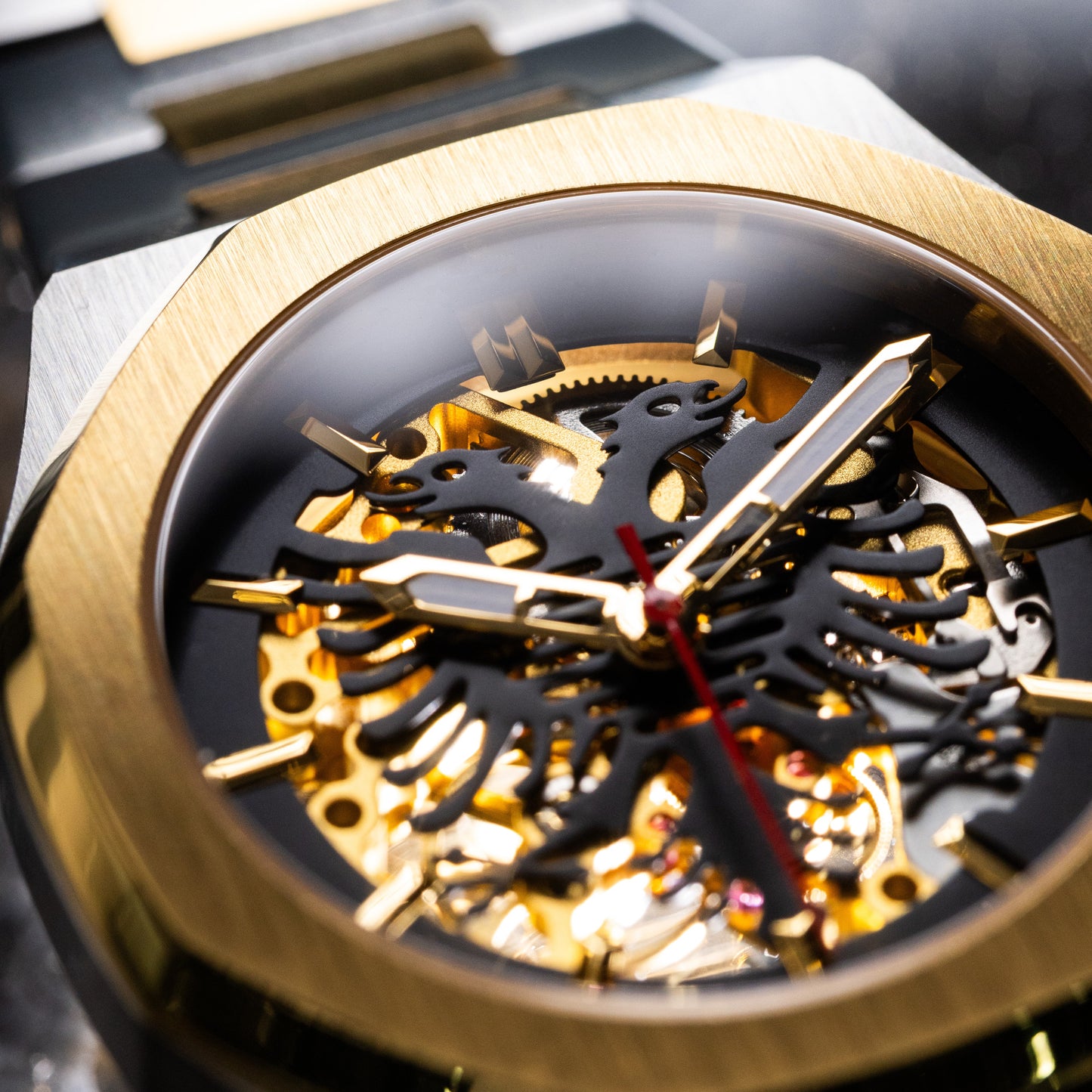 Albanian Eagle Watch -Close-up of a gold and silver watch with intricate mechanical design
